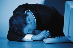 Businessman Asleep at Desk