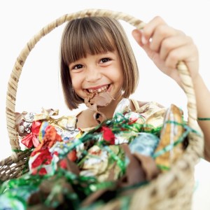 Young Girl Holding Basketful of Candy